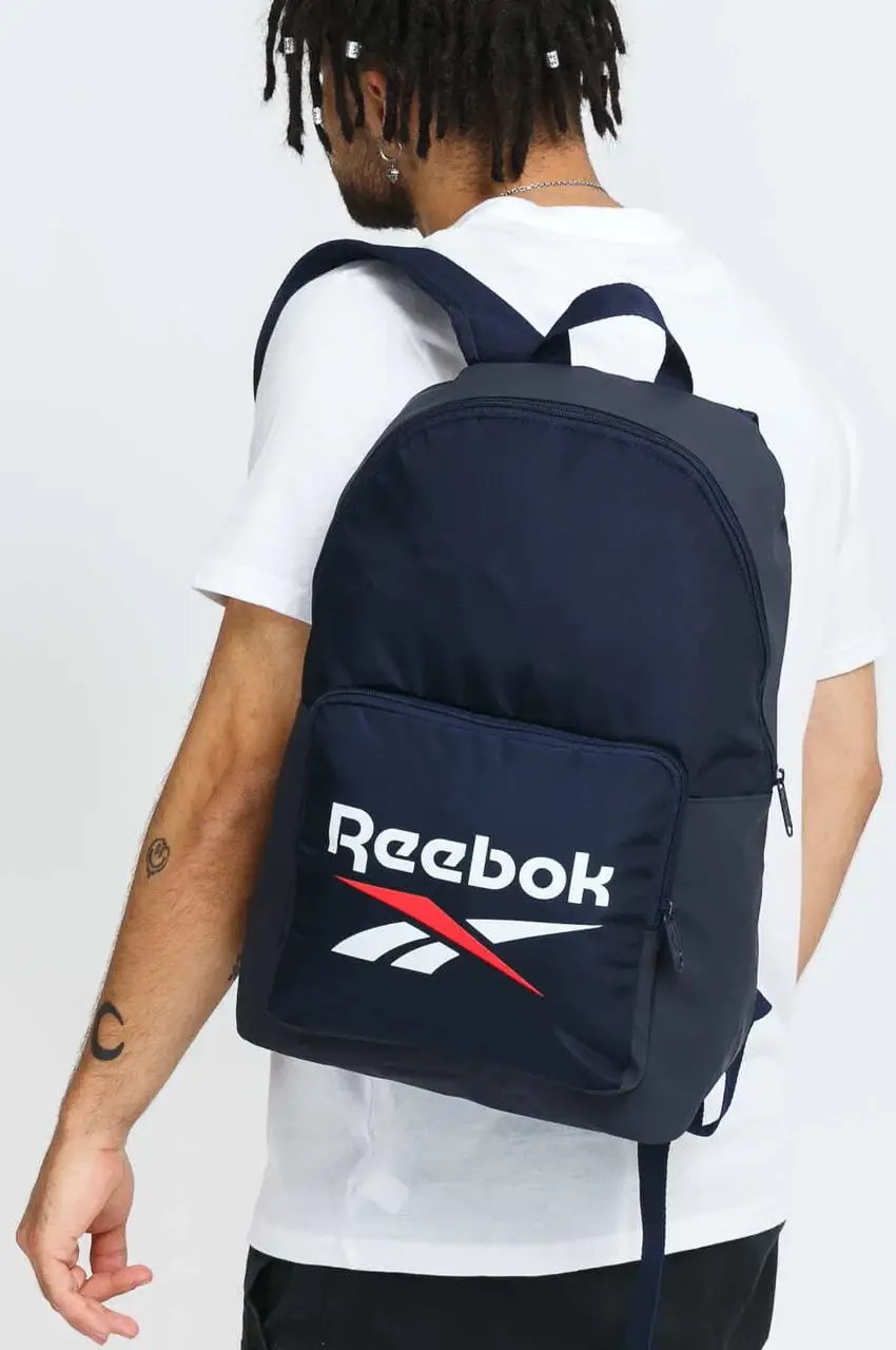 ФОТО КАРТИНКИ ЗОБРАЖЕННЯ Спортивний рюкзак 20L REEBOK BACKPACK CLASSICS FOUNDATION синій SGP0152 navy РОЗДРІБ ОПТ ГУРТ ГУРТОМ ОПТОМ! З ЄВРОПИ! ЯКІСТЬ! Купити Львів Характеристики Ціна Оплата Доставка "БОГОДАР" ІНТЕРНЕТ-МАГАЗИН Огляд Рейтинг Порівняння Як вибрати Якісний